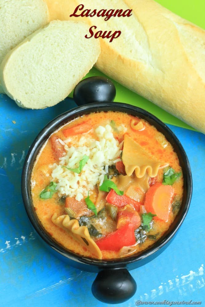 Lasagna Soup in a black bowl with cheese on top