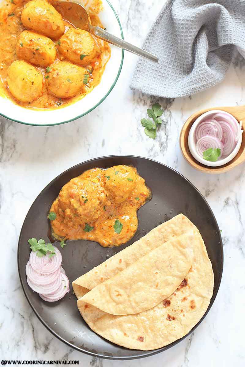 Instant Pot Dum Aloo - Best, Creamy, Scrumptious and Very Flavorful Indian Classic dish made of baby potatoes in a spicy onion-tomato-yogurt based gravy.