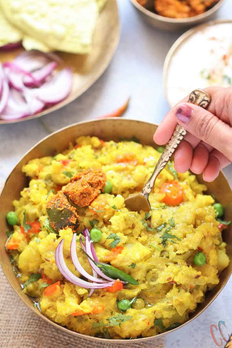 Instant Pot Quinoa Dal Khichdi - Healthy, easy to digest, wholesome, one pot comfort meal prepared by pressure cooking Quinoa, Moong Dal and Rice with lots vegetables and couple of spices. Whether you call it Masala Khichdi, Vaghareli Khichdi, Vegetable or Dal Khichdi, this one pot meal recipe is nutritious and light on the tummy.