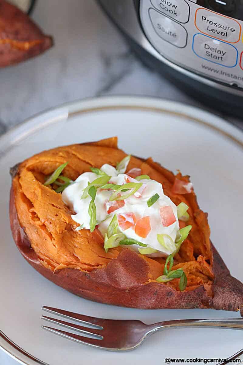 sweet potatoes loaded with sour cream, onion and tomatoes.