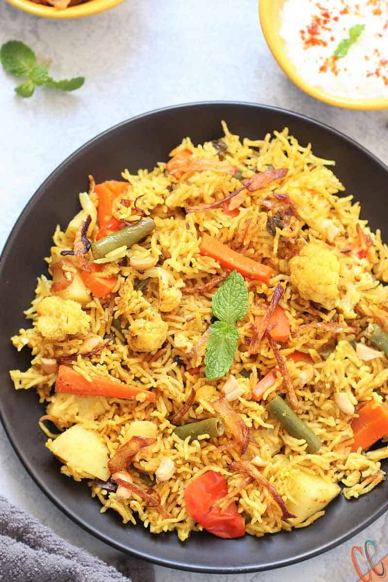 Instant Pot Vegetable Biryani - A mouth watering, bold, flavorful, universally loved Indian One Pot Rice Dish which is packed with vegetables and flavorsome spices. Biryanis are one of the most royal and grand rice based dish from Indian Cuisine.