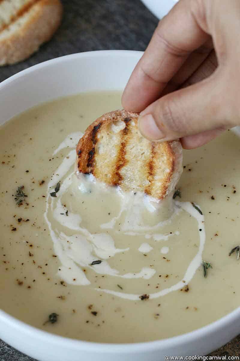 Dipping bread in Leek soup