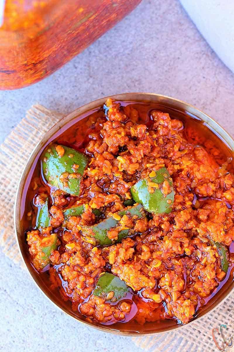 Mango Pickle | Gujarati traditional Methiya Keri Nu Athanu - Finger licking Pickle recipe Made with fresh raw mango, Methi Na Kuriya (coarsly crushed Fanugreek Seeds), Rai Na kuriya (Coarsely crushed mustard seeds), Salt, Red chili powder, Asafetida and Oil.
