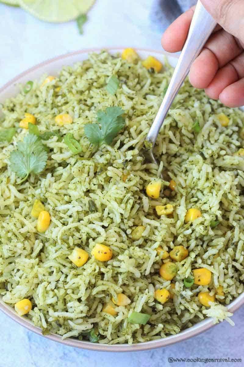Taking a bite of Mexican Arroz Verde aka Green rice with spoon