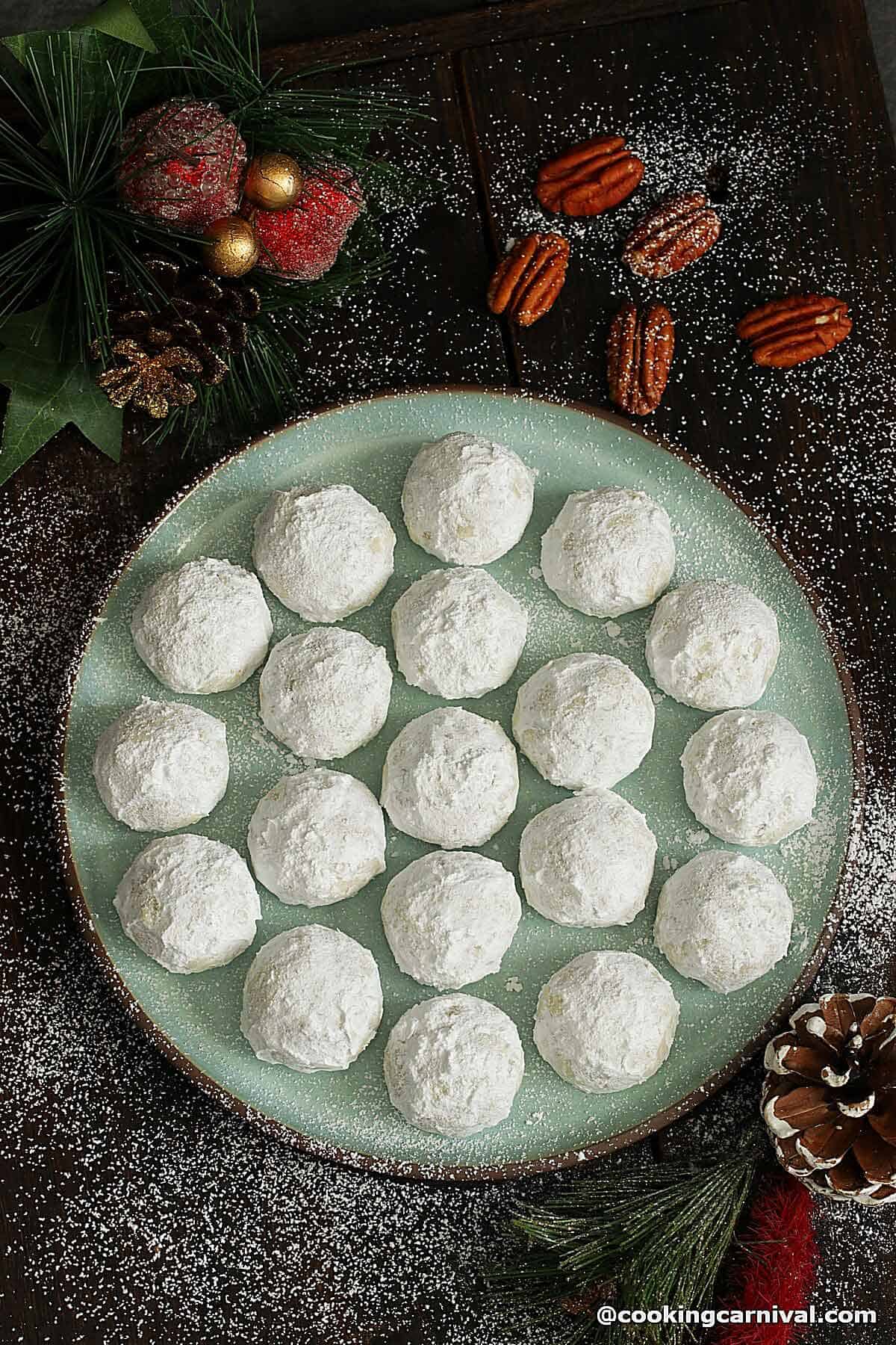 Mexican wedding cookies on a plate.